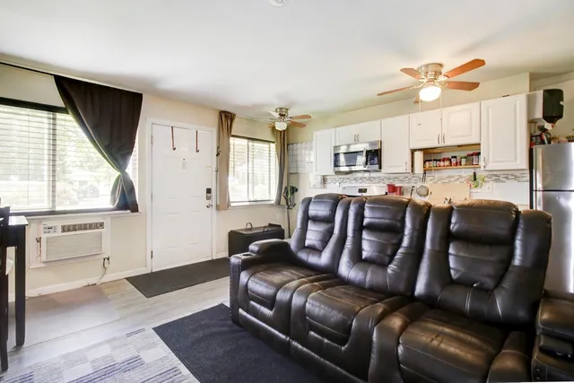 a kitchen view with refrigerator and cabinets
