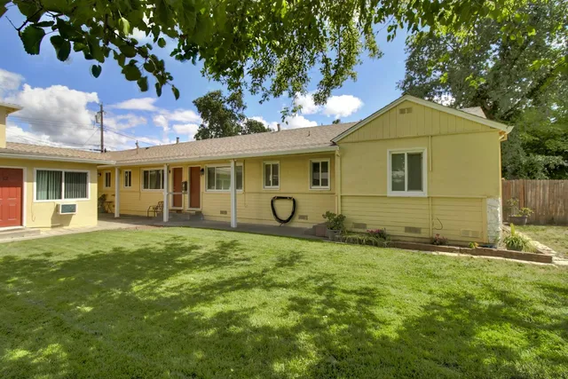 a view of a house with a big yard