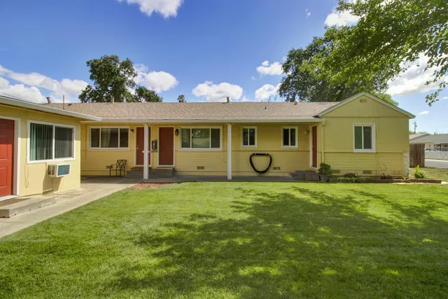 a front view of a house with a yard
