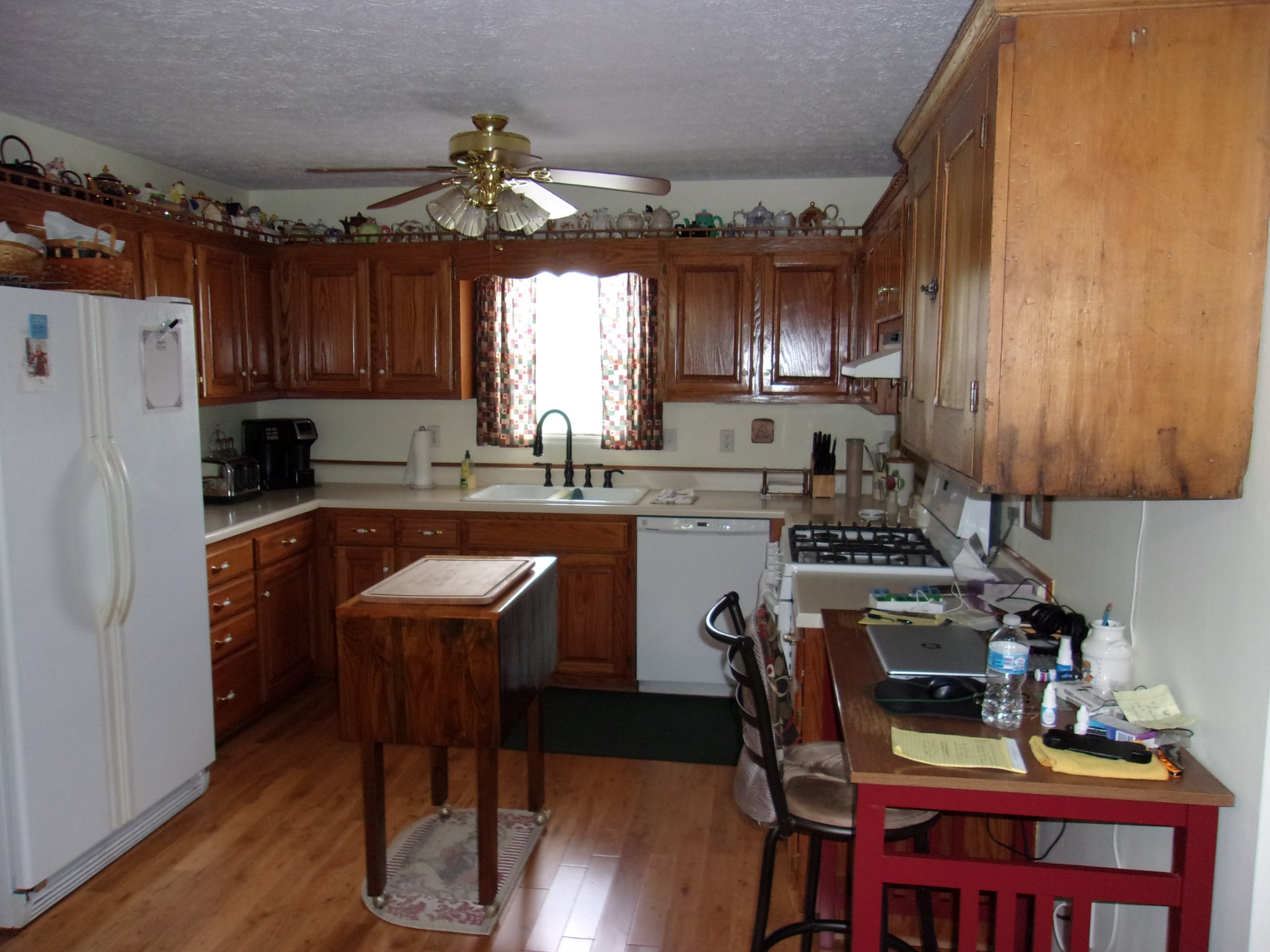 248 Spring Meadows Lane Morrison, TN 37357 - Photo 14 of 36 a kitchen with refrigerator a sink dishwasher a dining table and chairs with wooden floor