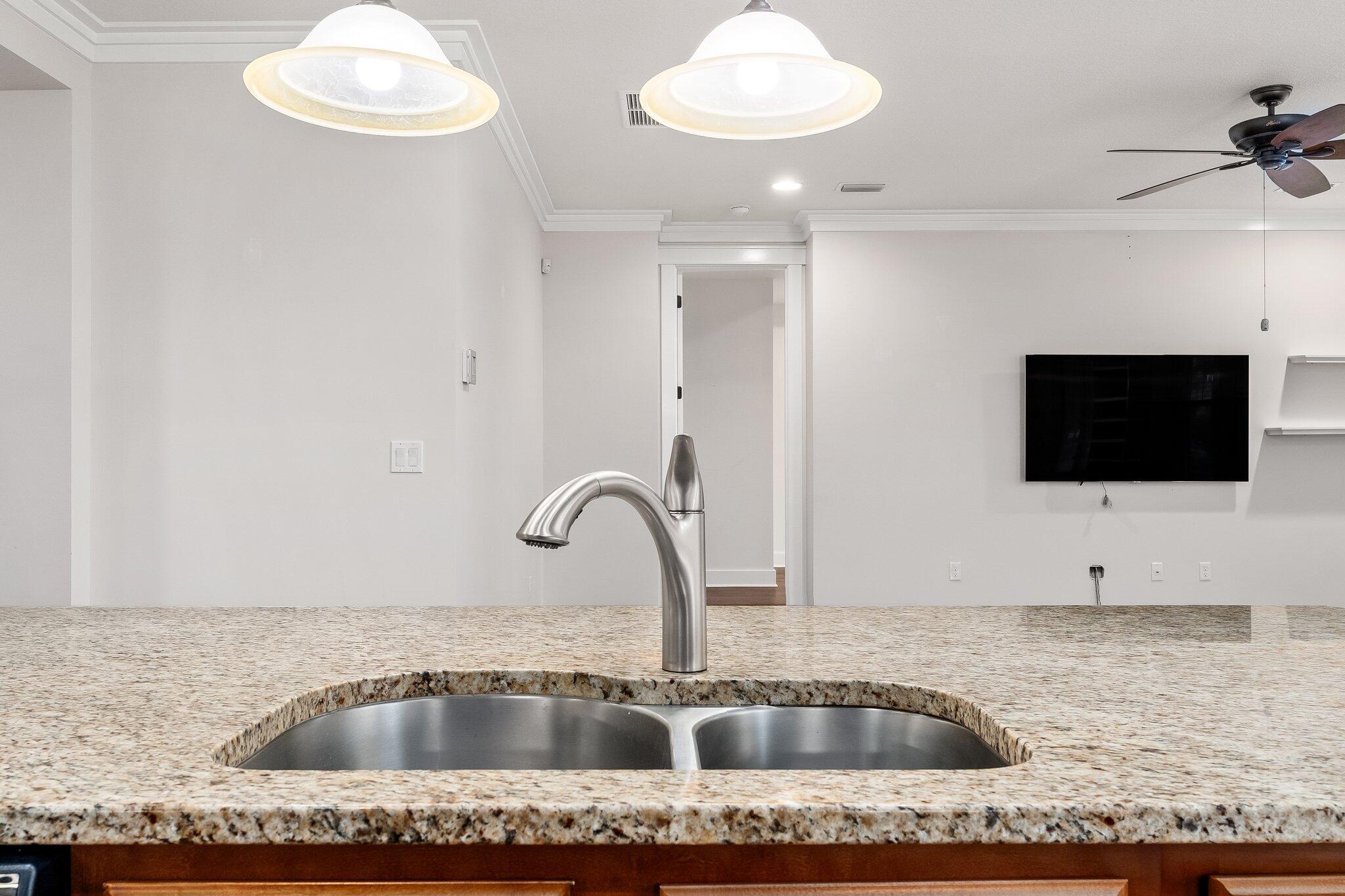 112 Blue Sage Road Panama City Beach, FL 32413 - Photo 16 of 46 a close view of a sink and kitchen island