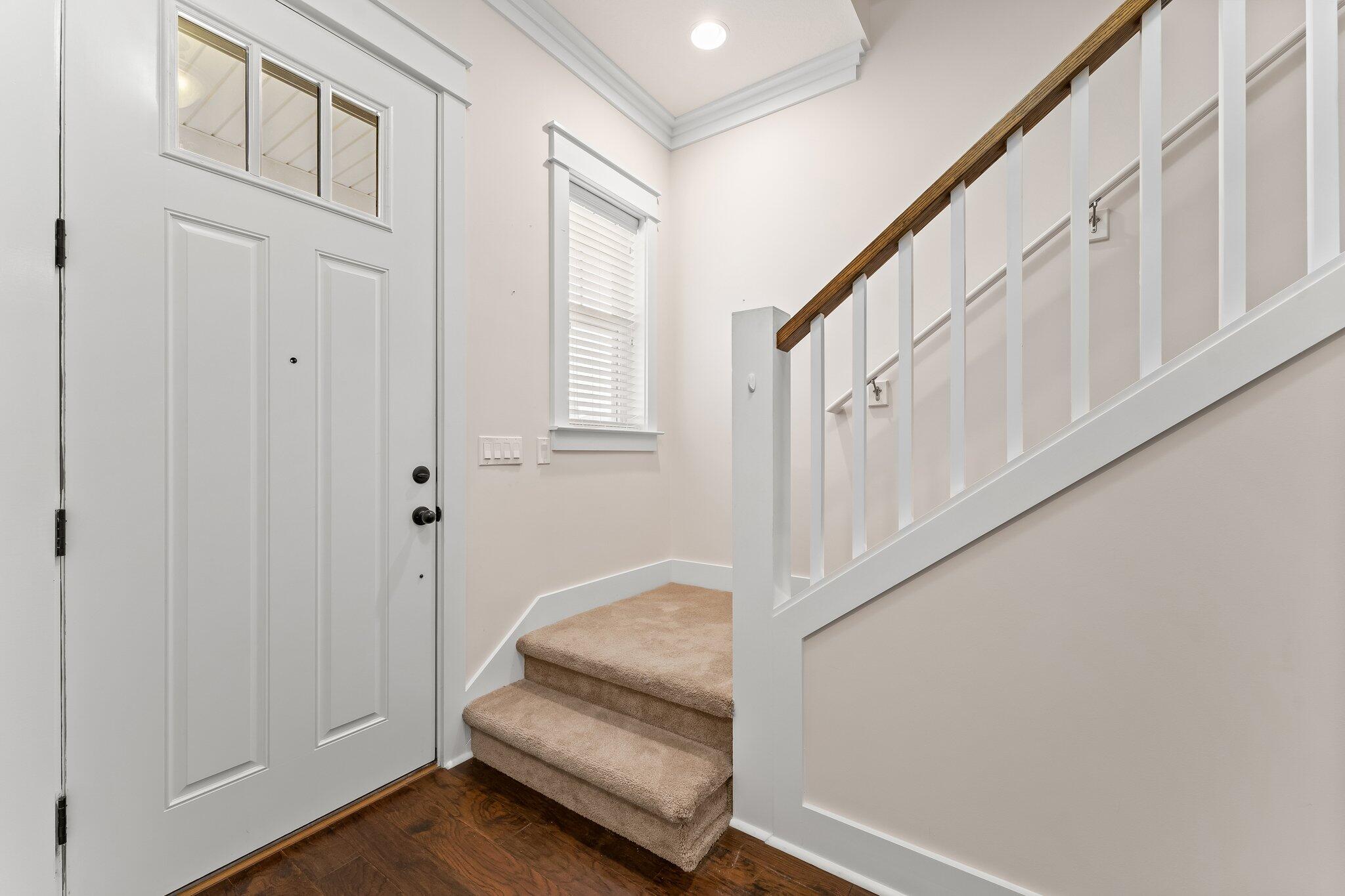 112 Blue Sage Road Panama City Beach, FL 32413 - Photo 28 of 46 a view of entryway with wooden floor and stairs