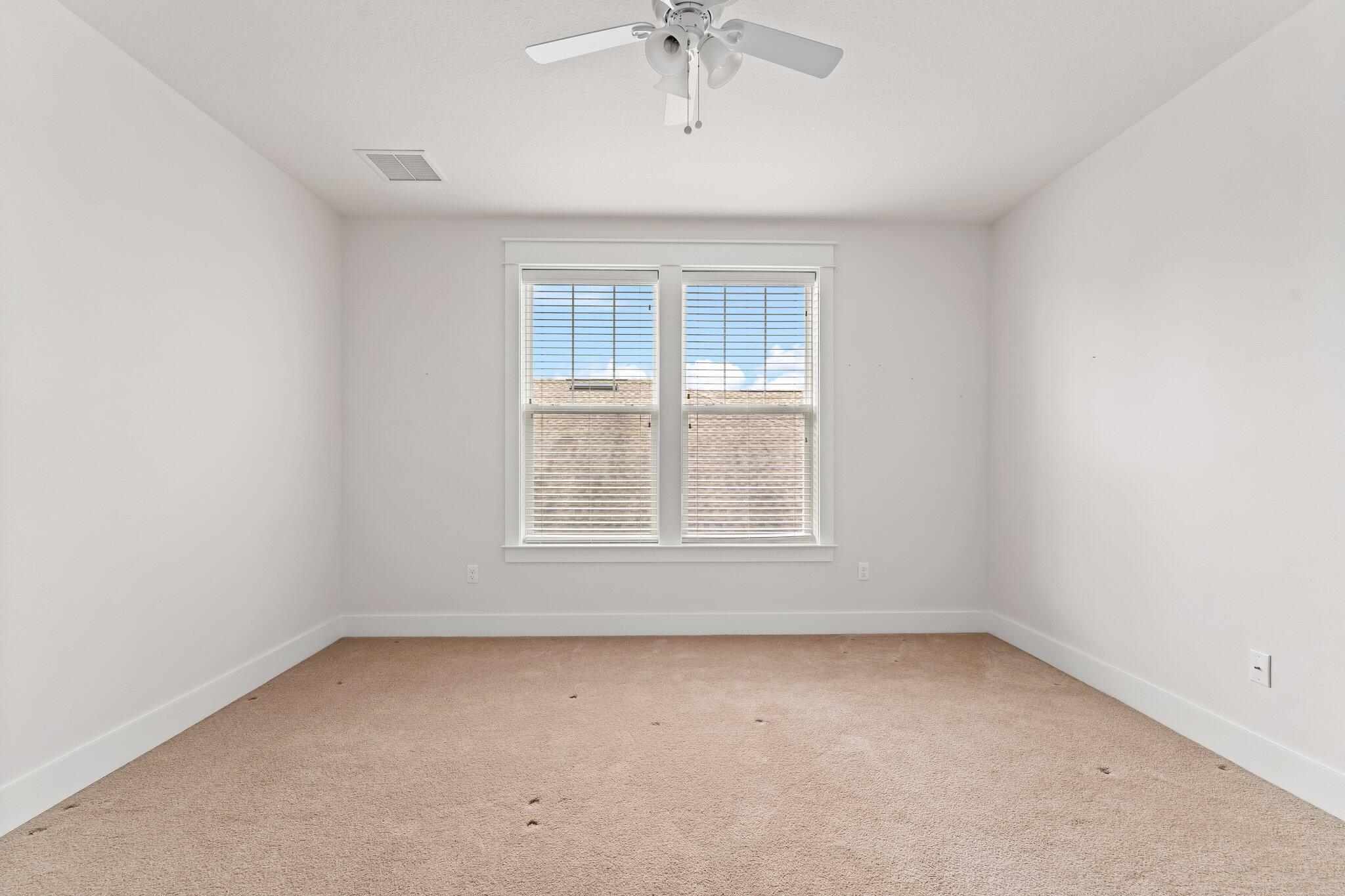 112 Blue Sage Road Panama City Beach, FL 32413 - Photo 31 of 46 an empty room with a window