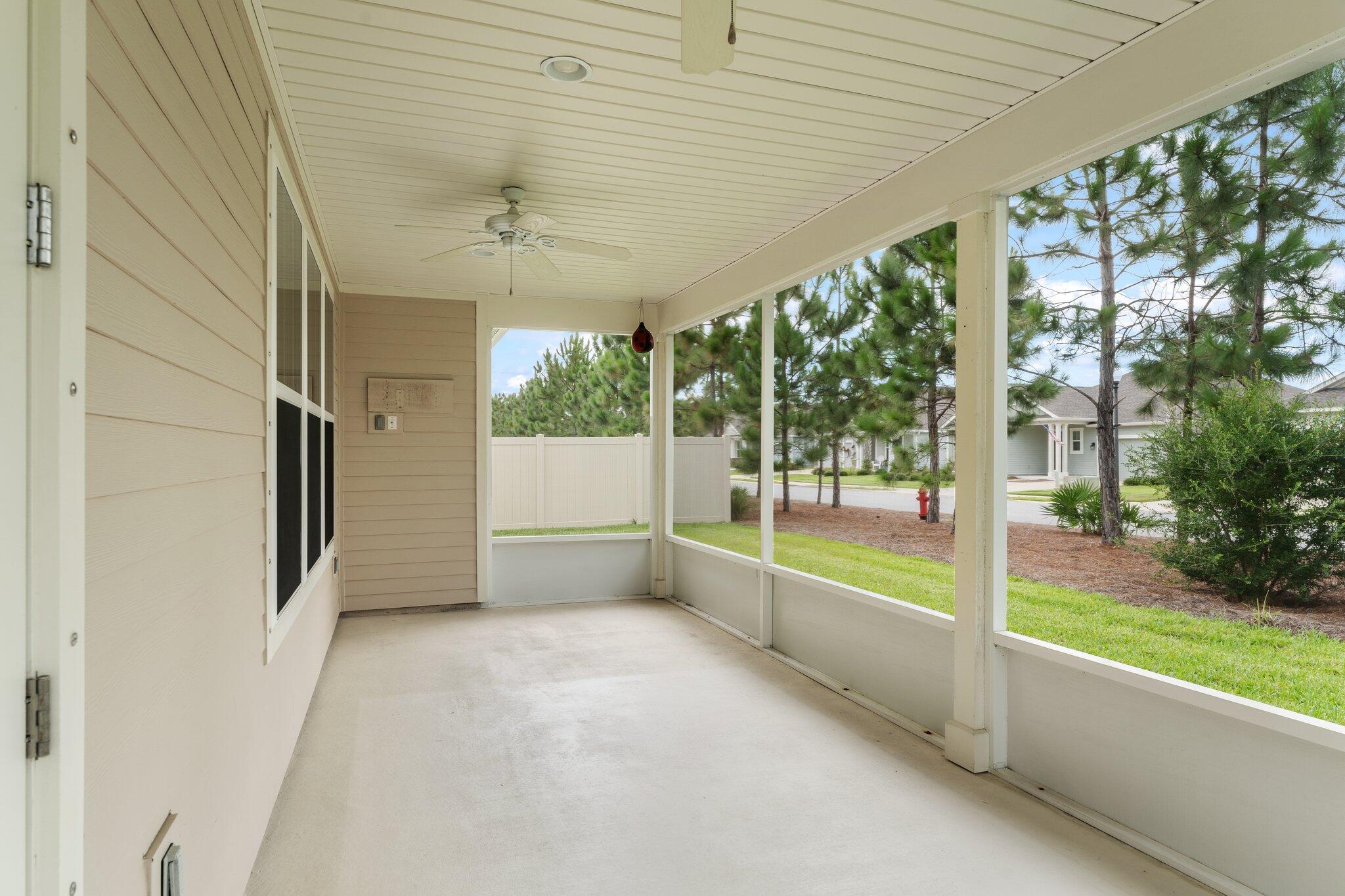 112 Blue Sage Road Panama City Beach, FL 32413 - Photo 32 of 46 a view of a porch with furniture and garden