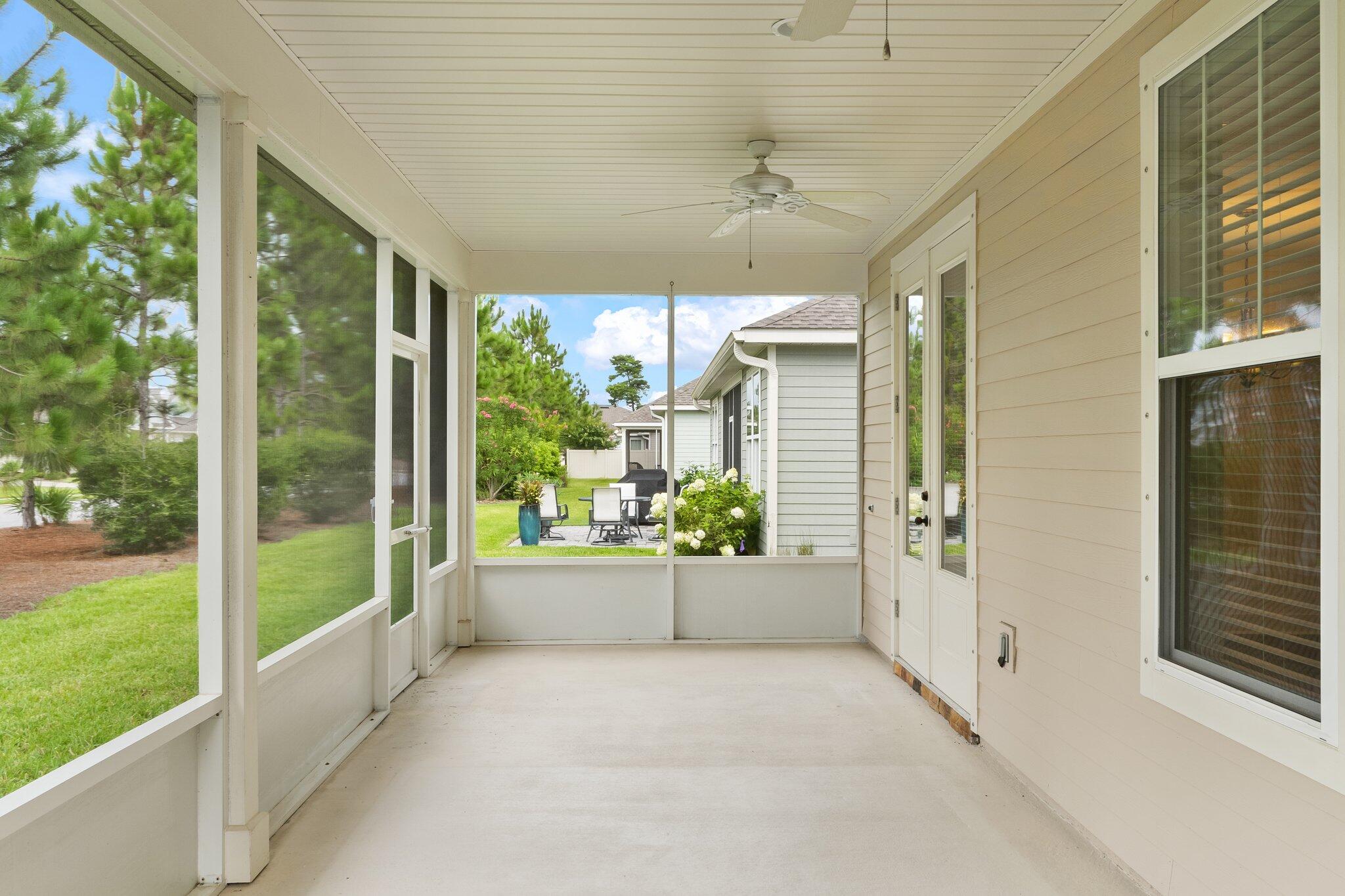 112 Blue Sage Road Panama City Beach, FL 32413 - Photo 34 of 46 a view of a porch with a floor to ceiling window and an outdoor view