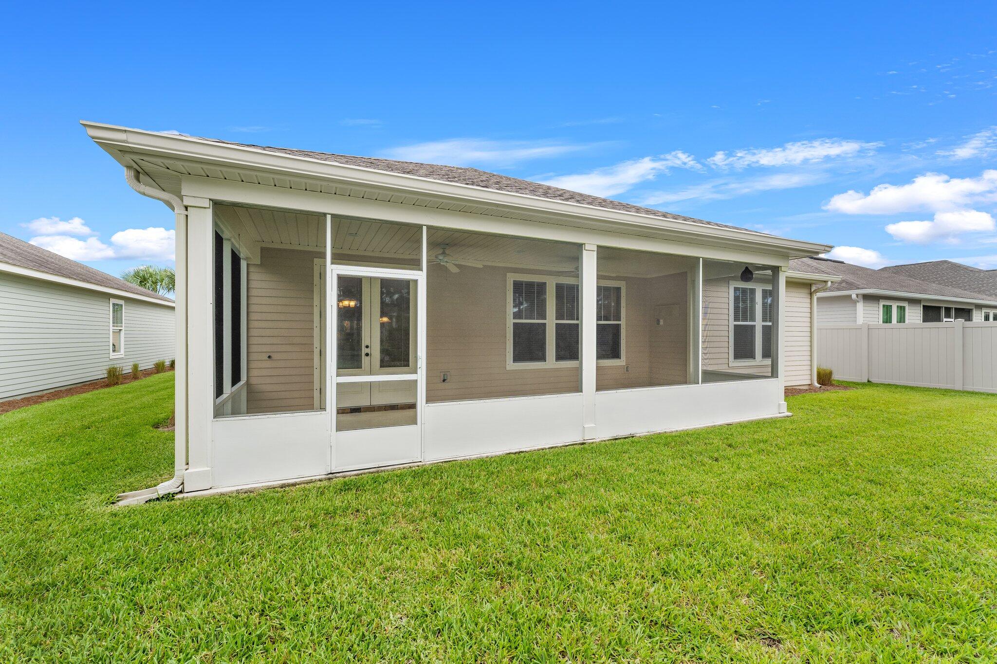 112 Blue Sage Road Panama City Beach, FL 32413 - Photo 35 of 46 front view of a house with a yard