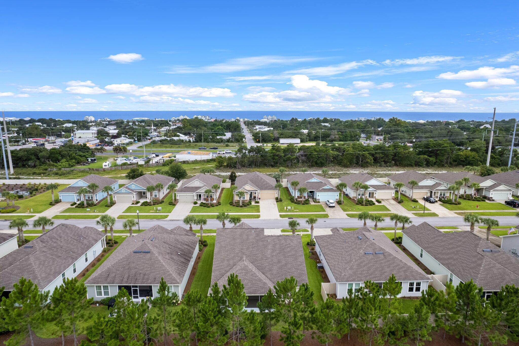 112 Blue Sage Road Panama City Beach, FL 32413 - Photo 46 of 46 an aerial view of residential houses with outdoor space and ocean view
