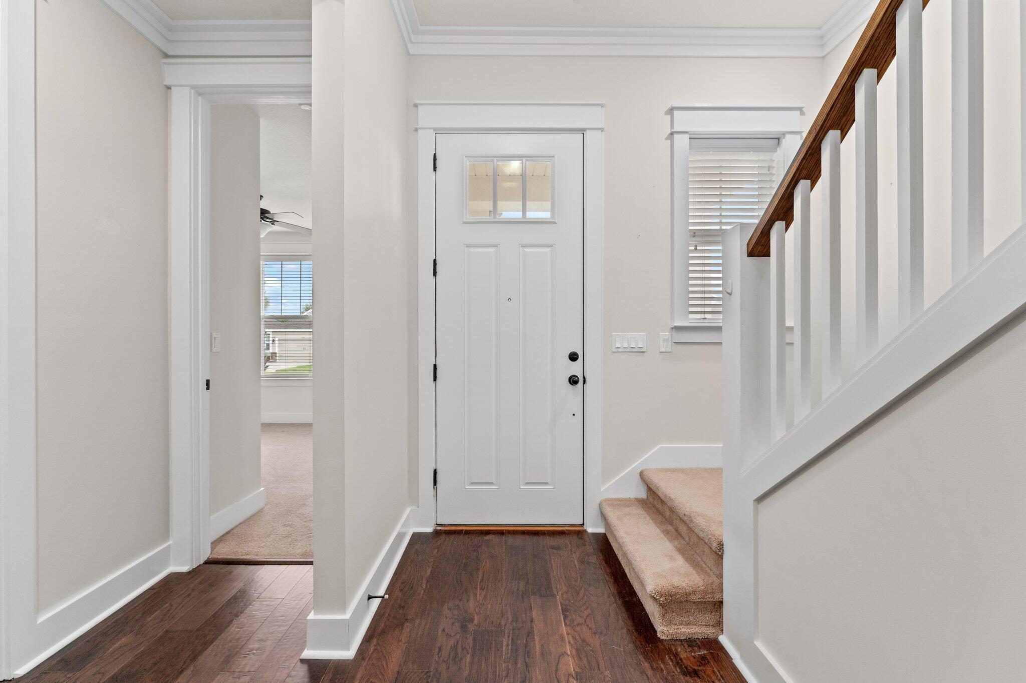 112 Blue Sage Road Panama City Beach, FL 32413 - Photo 5 of 46 a view of a hallway with wooden floor and staircase
