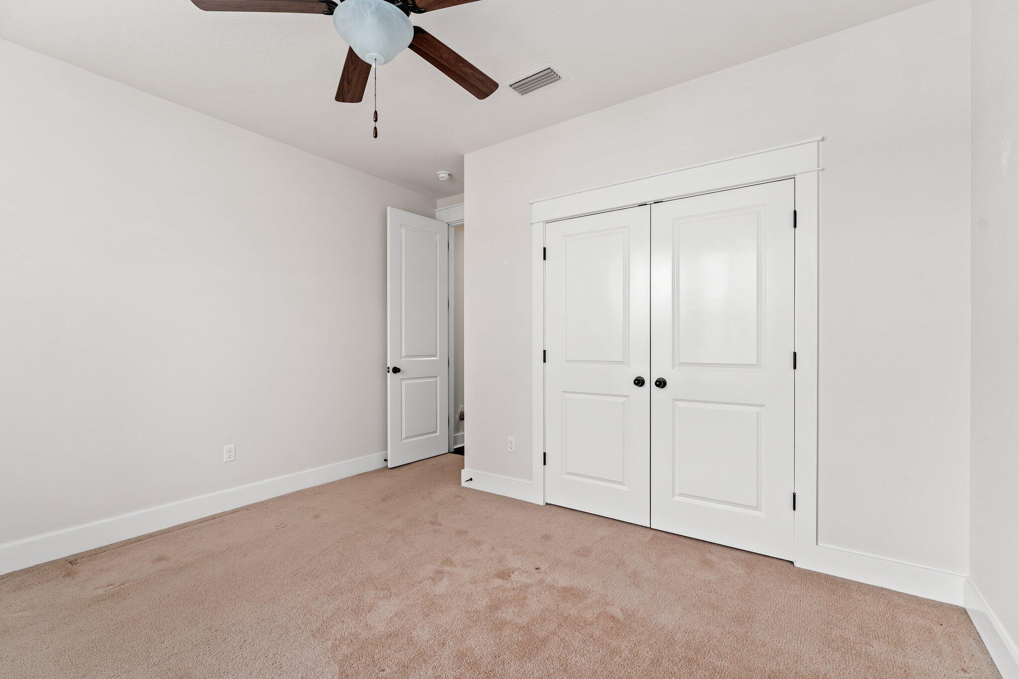 112 Blue Sage Road Panama City Beach, FL 32413 - Photo 7 of 46 an empty room with chandelier fan