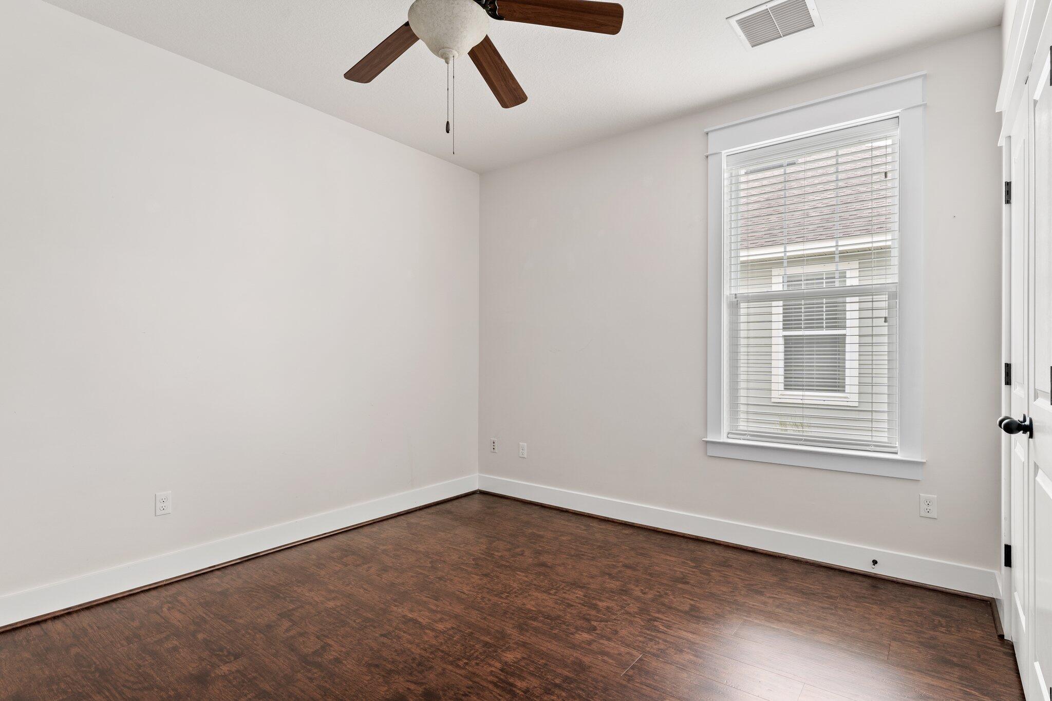 112 Blue Sage Road Panama City Beach, FL 32413 - Photo 9 of 46 an empty room with a window