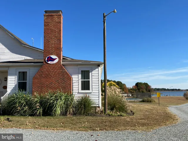 a front view of a house with yard