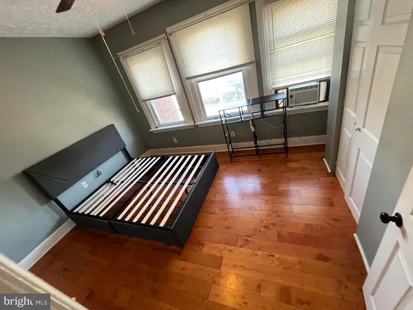 a view of staircase with wooden floor and chair