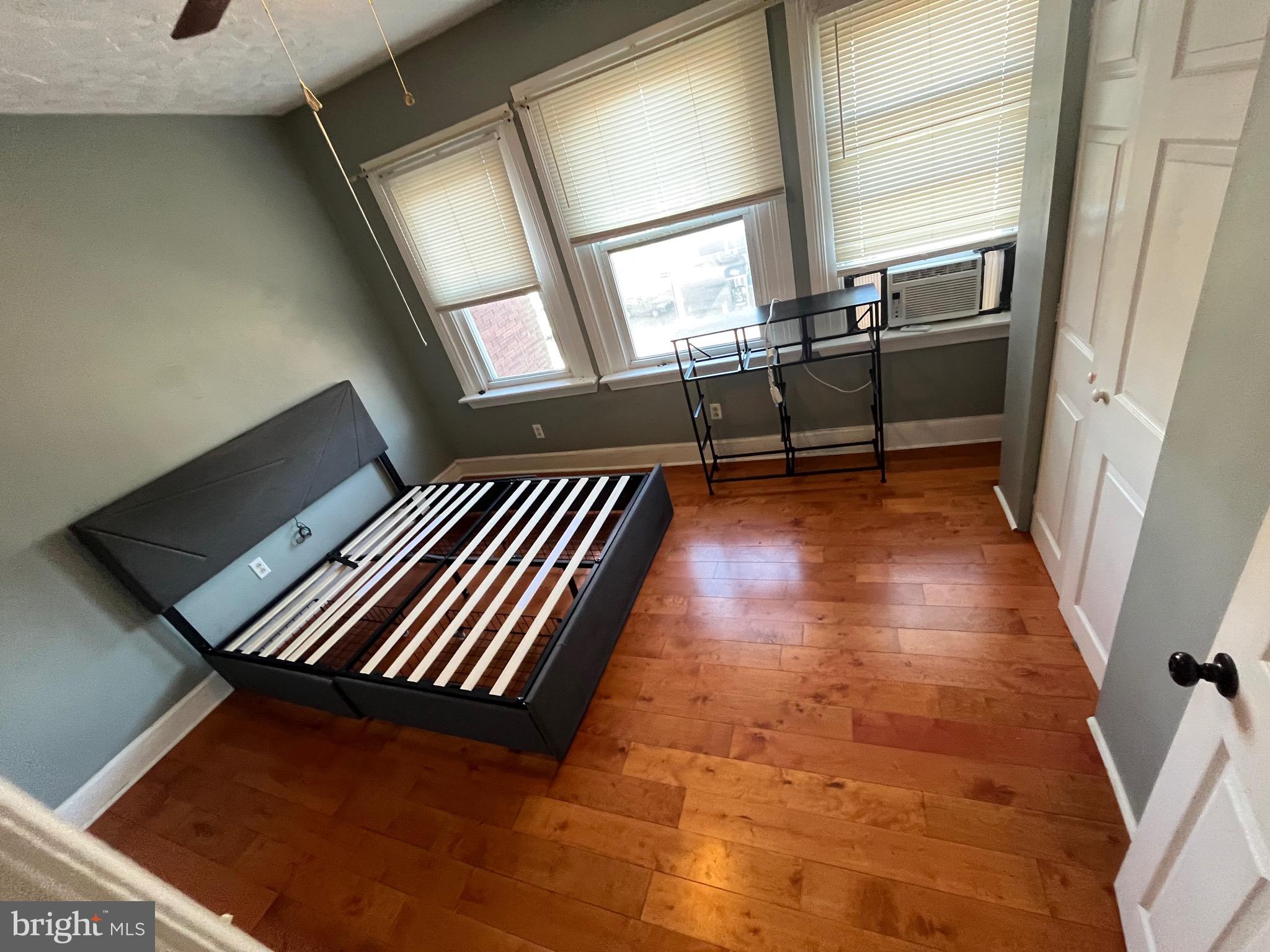 a view of staircase with wooden floor and chair