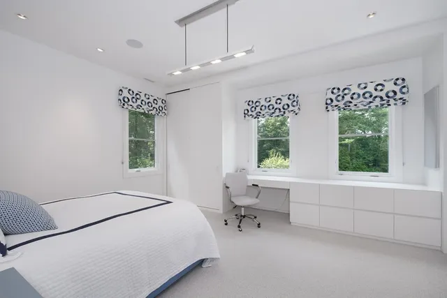 a bed room with a bed and a window