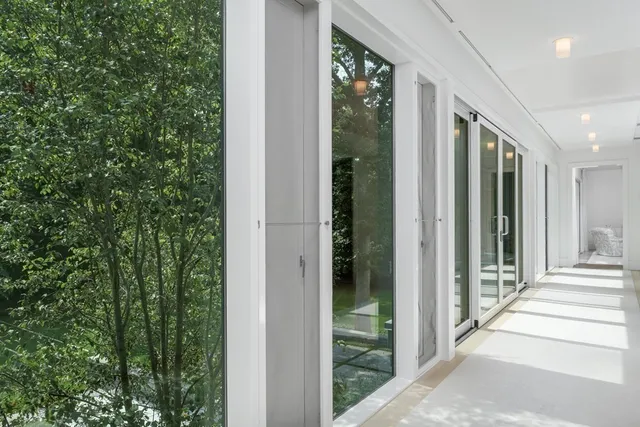 a view of a door and chair in the balcony
