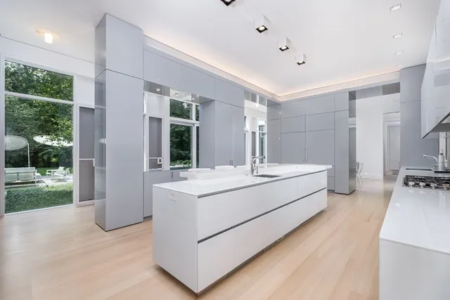 a bathroom with a sink mirror and a bath tub