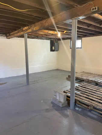 a view of a room with wooden floor