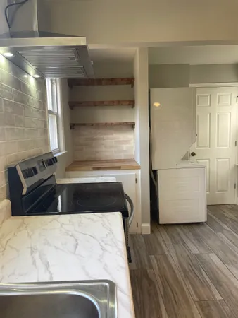 a view of kitchen and wooden floor