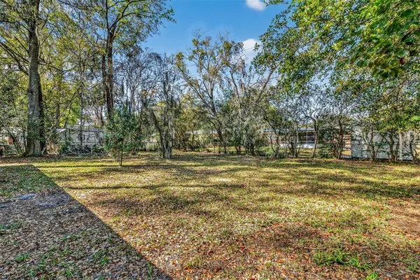a view of a yard with houses
