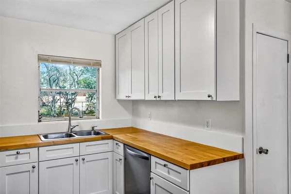 a kitchen with a sink and cabinets