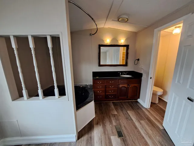 a view of entryway with wooden floor