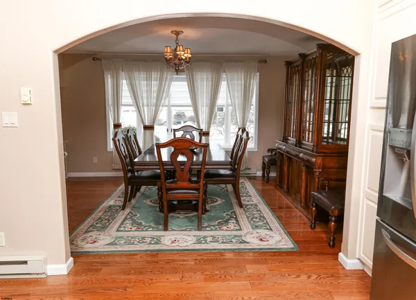 a dining room with a table and chairs