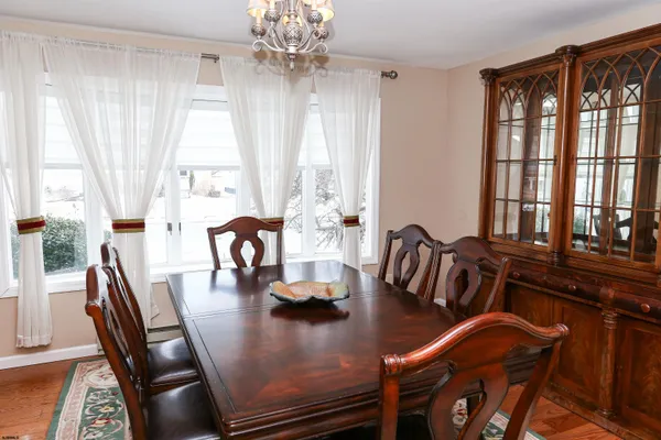 a kitchen with stainless steel appliances granite countertop a stove sink and cabinets