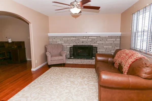 a living room with furniture and a window