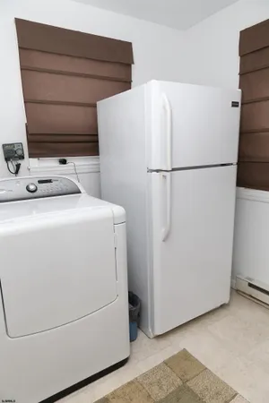 a view of a dining room with furniture and window
