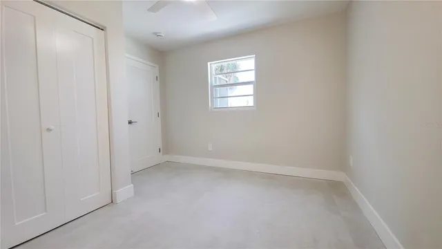 an aerial view of residential houses with outdoor space and ocean view