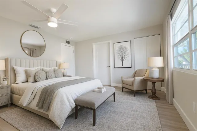 a kitchen with white cabinets and white stainless steel appliances