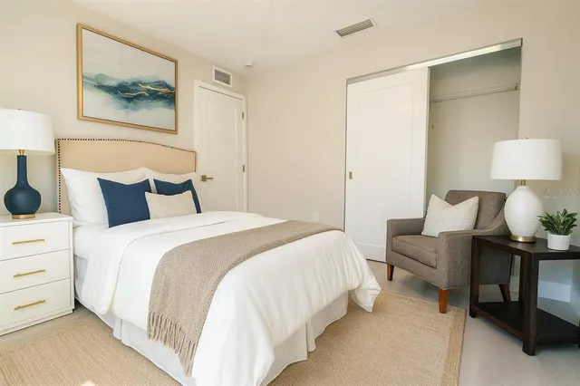 a kitchen with stainless steel appliances a sink a stove and cabinets