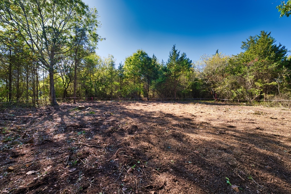 2 Horseneck Road Dartmouth, MA 02748 - Photo 8 of 11 a view of a yard with trees in the background