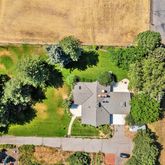 an aerial view of a residential apartment building with a yard