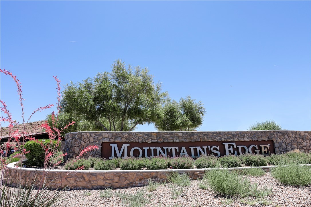 7375 Campbell Ranch Avenue Las Vegas, NV 89179 - Photo 37 of 45 Welcoming stone entry monument with mature landscaping creates an appealing community approach.