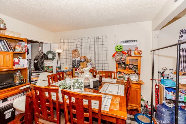 a living room with furniture and a lamp
