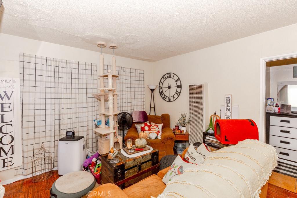 518 West Fredricks Street Barstow, CA 92311 - Photo 26 of 35 a living room with furniture and a lamp