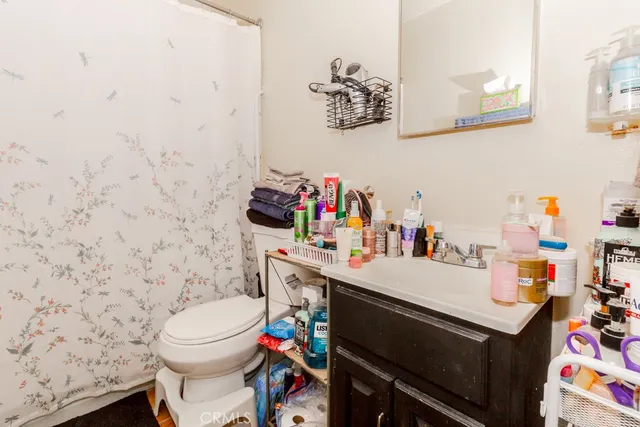 a bed room with a bed and a flat screen tv