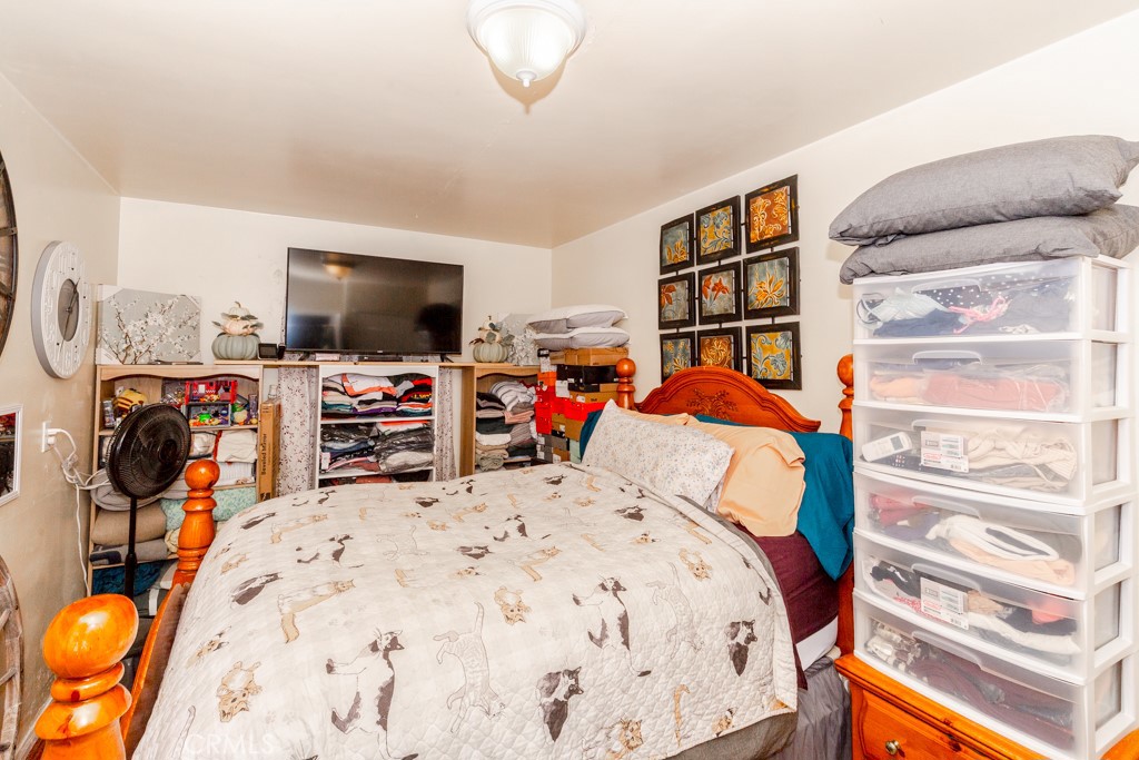 518 West Fredricks Street Barstow, CA 92311 - Photo 28 of 35 a bed room with a bed and a flat screen tv