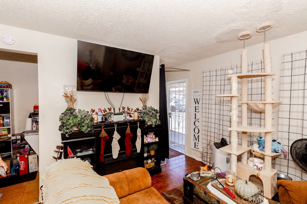 518 West Fredricks Street Barstow, CA 92311 - Photo 30 of 35 a living room with furniture and a flat screen tv