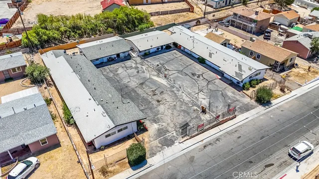 an aerial view of a house with yard