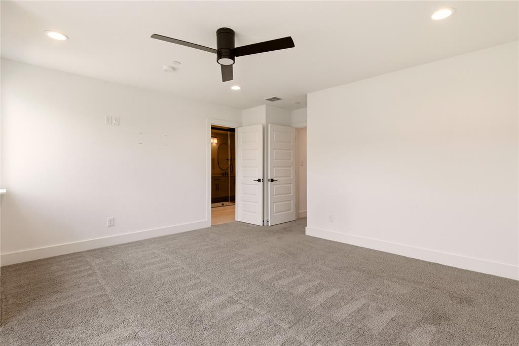 8909 Lowell Street Rowlett, TX 75089 - Photo 17 of 25 Unfurnished bedroom with light carpet, recessed lighting, ceiling fan, and ensuite bathroom