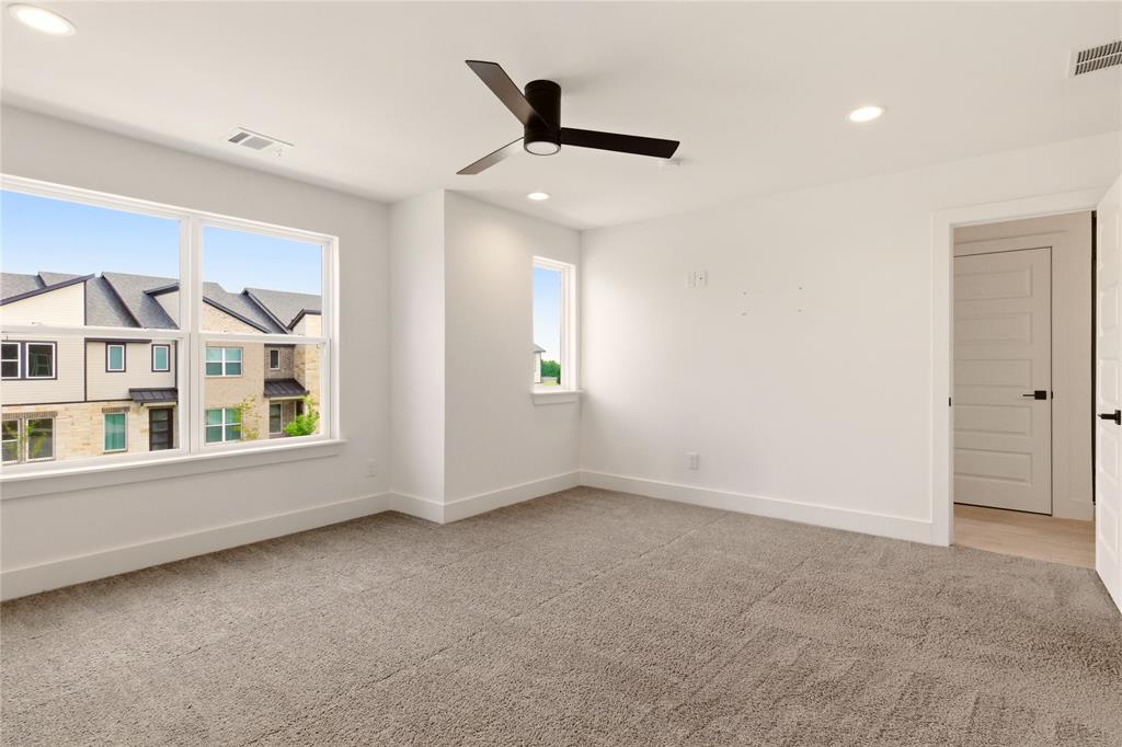 8909 Lowell Street Rowlett, TX 75089 - Photo 18 of 25 Unfurnished room with light carpet, recessed lighting, and a ceiling fan