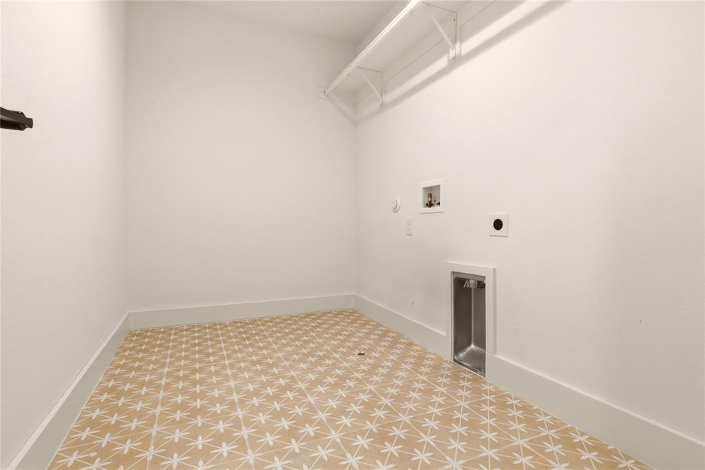 8909 Lowell Street Rowlett, TX 75089 - Photo 20 of 25 Laundry room with hookup for a gas dryer, tile patterned floors, washer hookup, and hookup for an electric dryer
