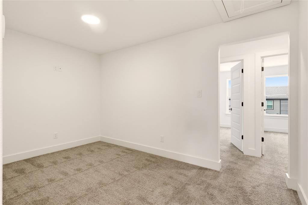 8909 Lowell Street Rowlett, TX 75089 - Photo 22 of 25 Empty room featuring light colored carpet