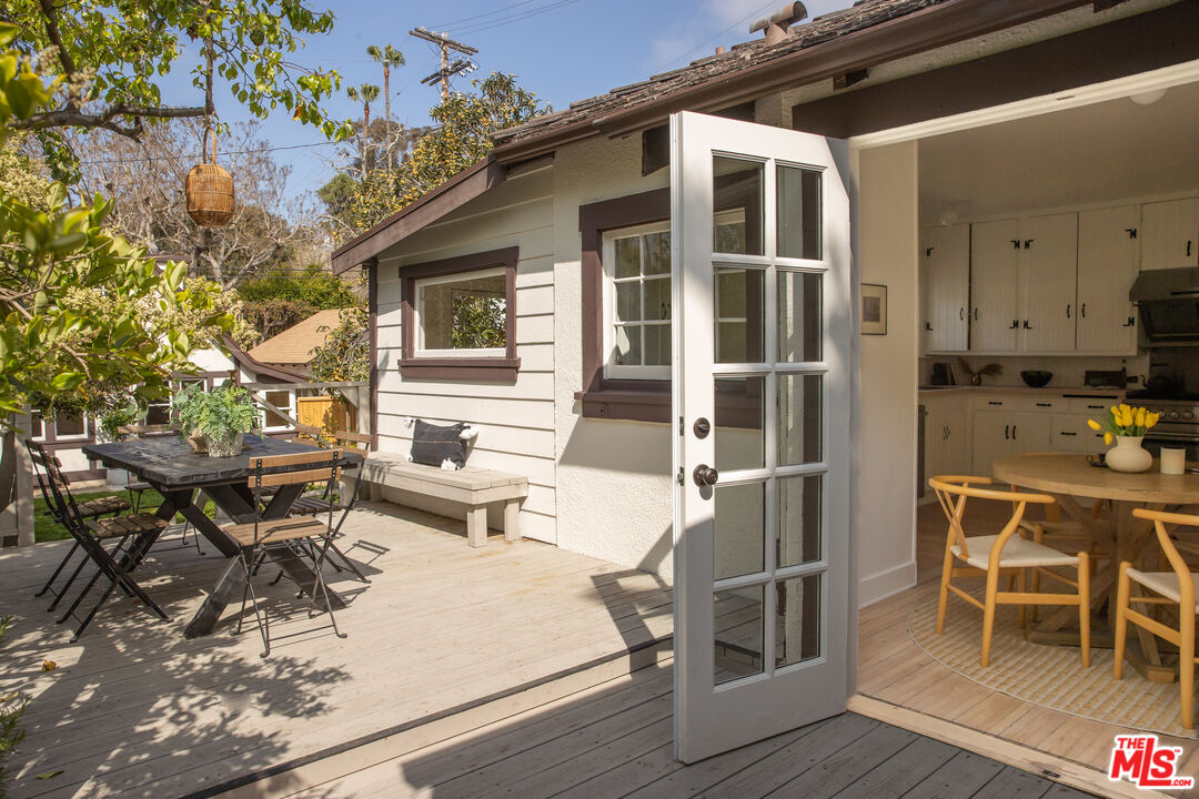 329 Sycamore Road Santa Monica, CA 90402 - Photo 5 of 26 a view of a dinning table and chairs in patio of the house