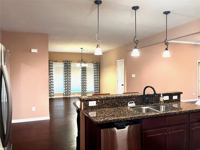 a kitchen with a sink and window
