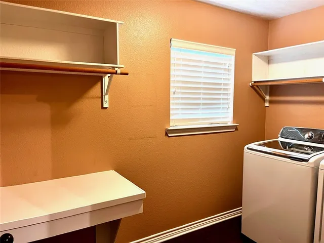 a room with dryer and washer