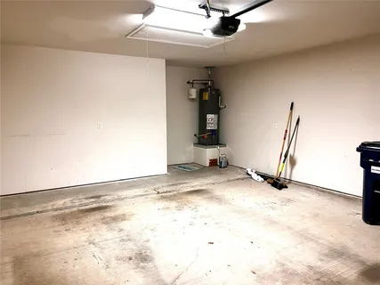 a view of a livingroom with a stove and a ceiling fan