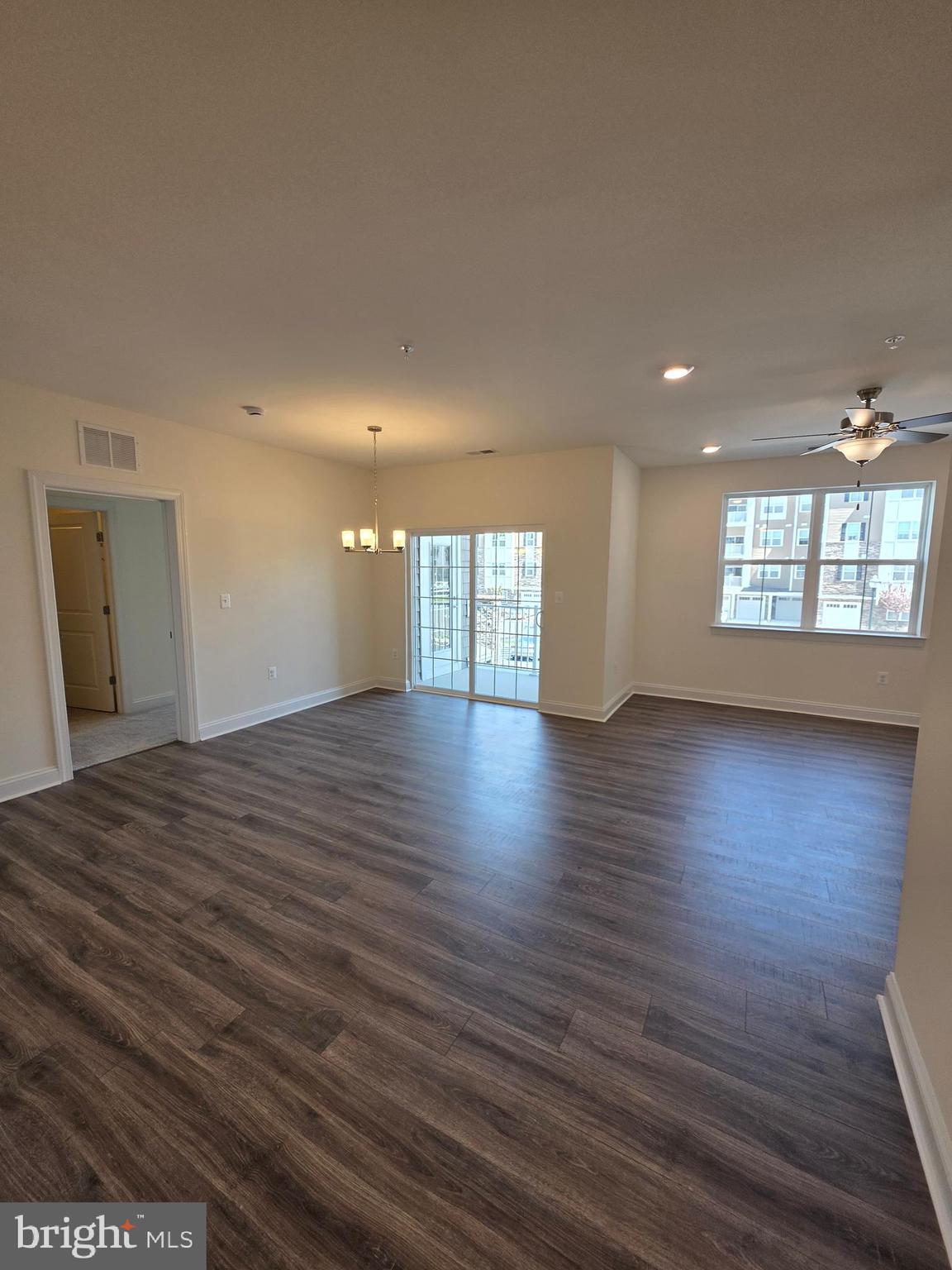 404 Bold Ruler Court, Unit 204 Havre de Grace, MD 21078 - Photo 21 of 31 a view of an empty room with wooden floor and a window